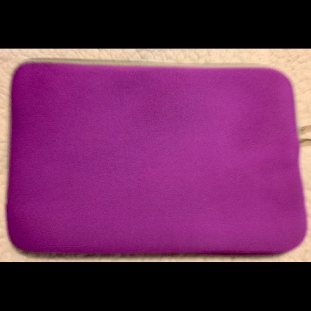 A New without tags Neoprene Purple Sleeve.